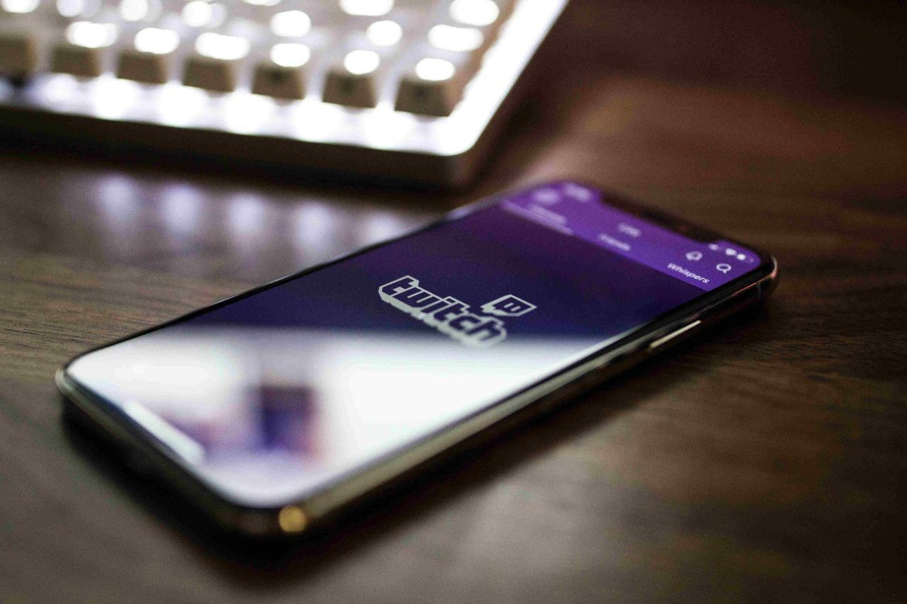 Photo of a twitch logo on a mobile phone market trends